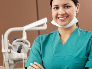 A dental assistant in a dental office.