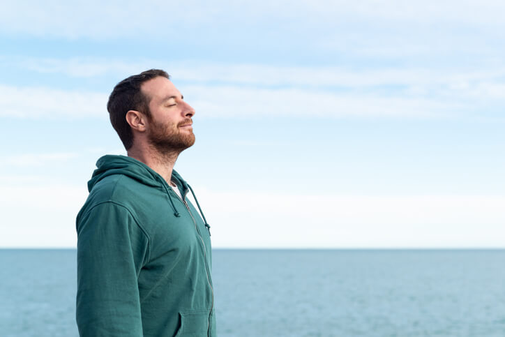 A male practical nurse meditating after practical nurse training.