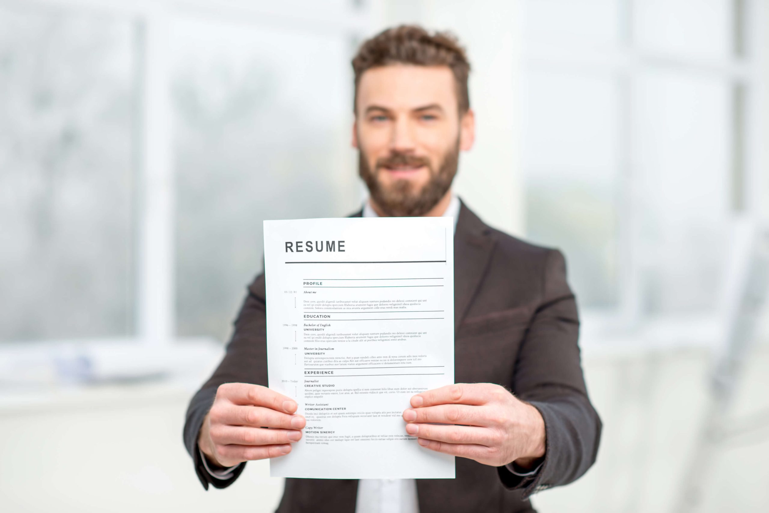 A healthcare assistant reviewing his resume after completing his healthcare assistant training