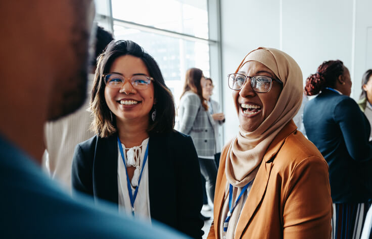 A social service worker training grad attending a networking event