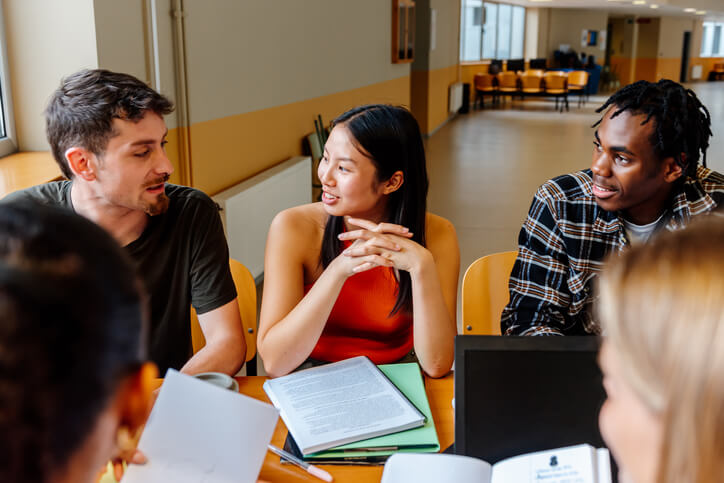 A group of career training students studying together in a classroom