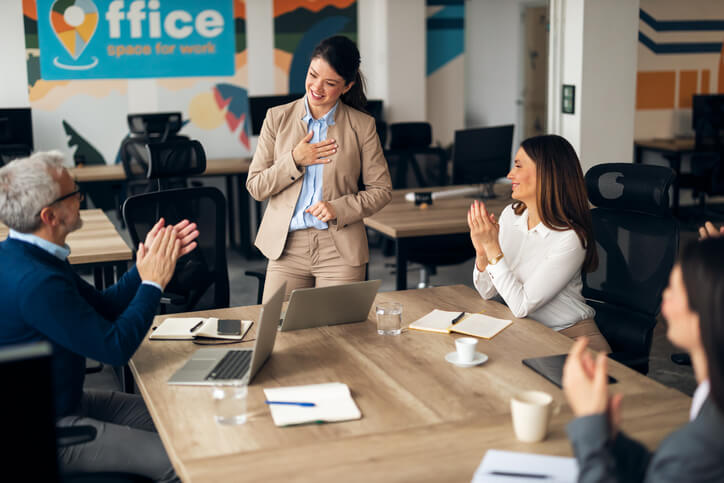 A business professional leading a meeting with empathy