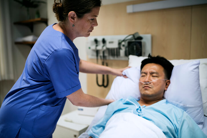 A Licensed Practical Nurse caring for a patient in a hospital