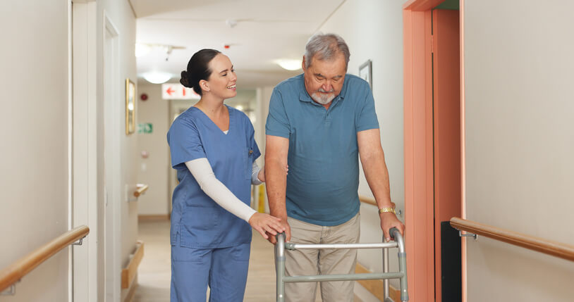A practical Nurse supporting a patient during recovery