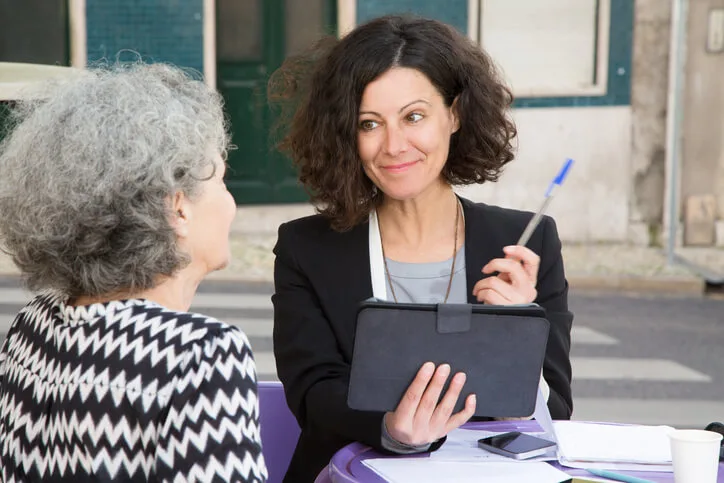 A community Support Worker training graduate discussing goals with a client