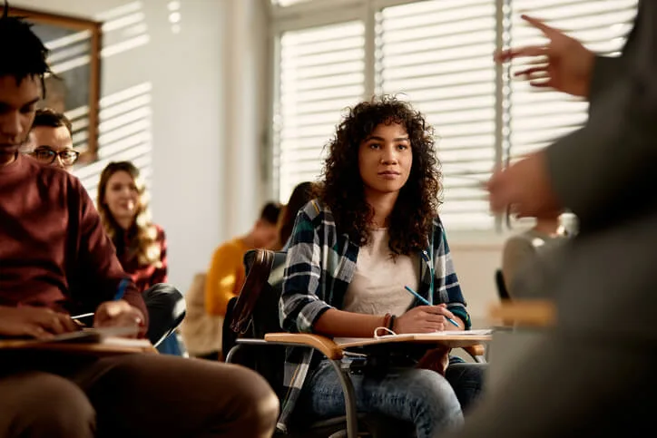 A community support worker student learning trauma-informed principles in class