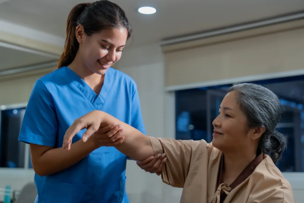 Nursing student working with a patient during clinical placement