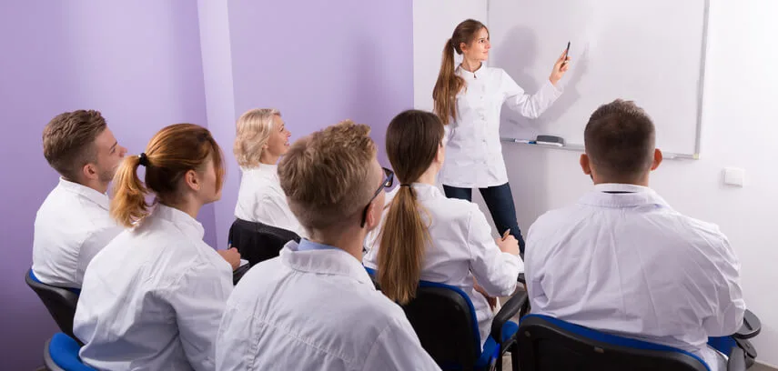 An Instructor teaching in a dental assistant training class