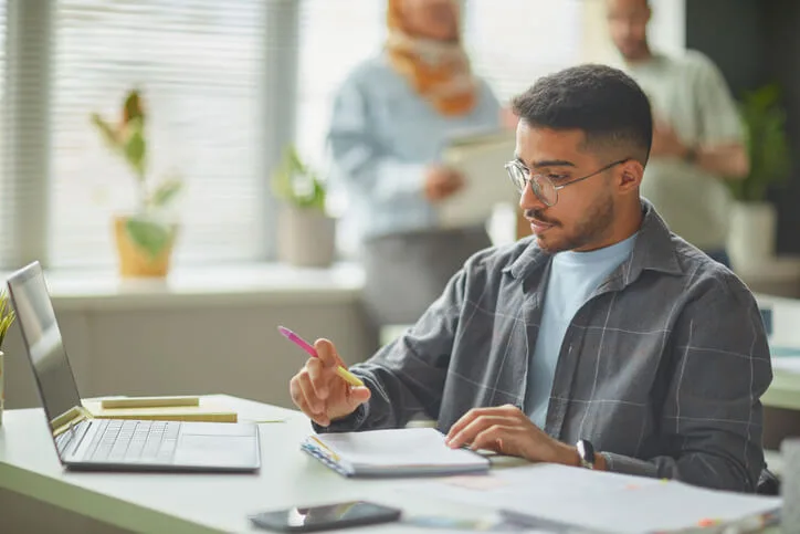A community college student preparing their skills & abilities on a resume for professional use
