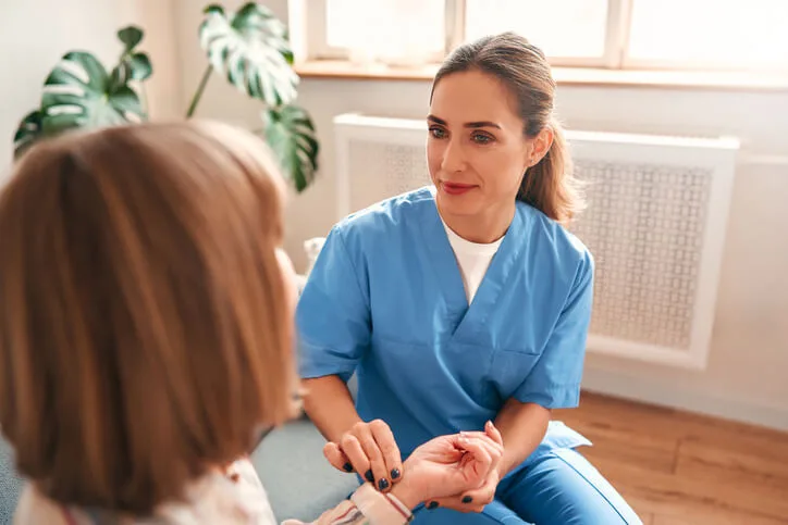 Licensed practical nurse providing patient care in a healthcare setting