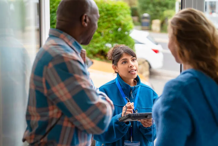A community outreach worker providing resources and guidance to clients in need