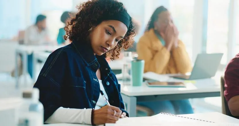 A Social Service Worker student learns case support skills in a classroom setting.