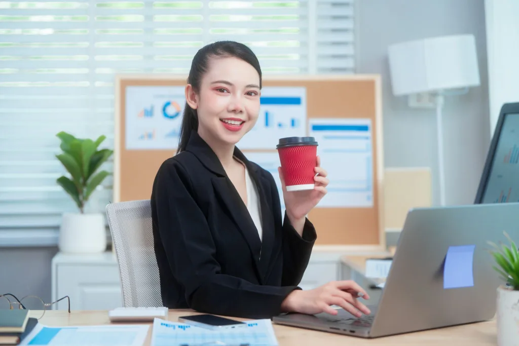 An office administrator organizing schedules and business documents in a professional office
